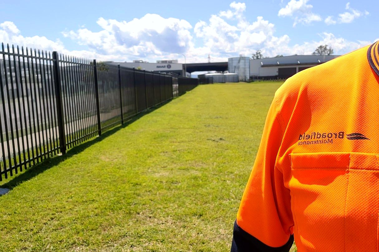 Broadfield team member in branded hi-vis on a maintained commercial site